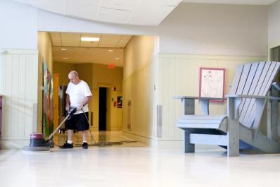 Malcolm Broadbent school hallway custodian