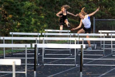 Julia Reagan Rose Engler jumping hurdles