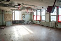 Bright red tape is used everywhere to guide demolition efforts.