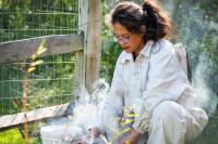 Nina Gordon preparing to check hives.