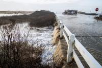 Floodwater running over Katama road into Herring Creek near the left fork entrance of South Beach.