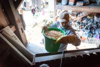 Andrew Woodruff carrying wood shavings into the loft.