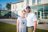 Aquila co-owners Jennifer Straub and Del Araujo in front of the museum.