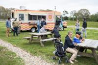 Goldie's Rotisserie food truck provided refreshment outside.