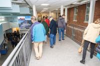 Tour groups cross the walkway.