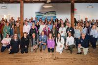 Grant recipients gather together downstairs at the grange hall.