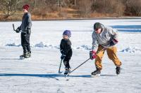 Jason Gale (right) shows younger players how it's done.