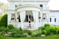Lillie Cabral models on the porch of the Fisher house.