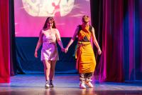 Josephine Powers and Jason Jarrell walk out on the runway.