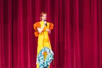Art teacher Tiffiney Shoquist introduces. the student fashion show.