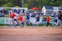Little leaguers run the bases.
