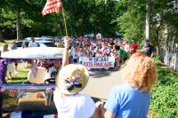 Encouraging the young marchers.