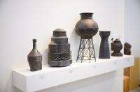Industrial forms contrast the natural material.