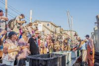 Crowds gather to watch the shucking competition.