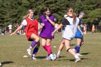 Girls soccer hopefuls go at it.