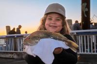 A towel to hold the fish reduces hand sliminess.