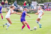 Reese Malowski with a pass between defenders.