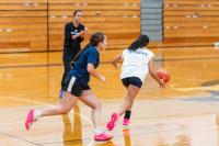 Girls basketball coach Mary Korba watches practice.