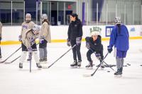 Coach Mallory Watts cues up a shot.