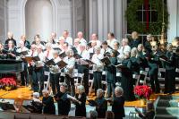 The stage overflowed with singers and instruments.