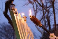 Lighting the first candle in the snow.