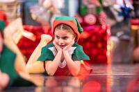 Christmas elves watch on.