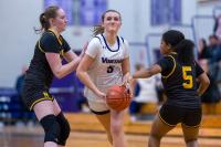 Olivia McCormick pushes through Nauset defenders.